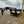 Load image into Gallery viewer, 2027 PJ 8.5X25 LQ FLATBED GOOSENECK W/ MONSTER RAMPS/14 PLY TIRES/15680# GVWR
