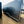 Load image into Gallery viewer, PREOWNED 2025 CARMATE 8X20 ADVANTAGE W/ ADDITIONAL HEIGHT/AWNINGS/VINYL WALLS/AC UNIT/ BARN DOORS
