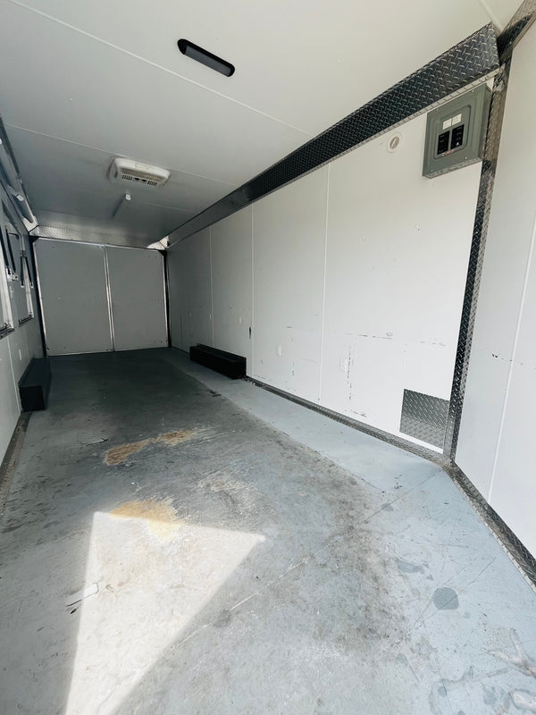 PREOWNED 2025 CARMATE 8X20 ADVANTAGE W/ ADDITIONAL HEIGHT/AWNINGS/VINYL WALLS/AC UNIT/ BARN DOORS