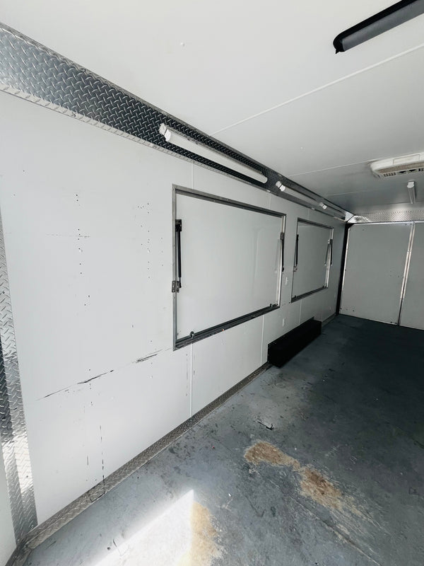 PREOWNED 2025 CARMATE 8X20 ADVANTAGE W/ ADDITIONAL HEIGHT/AWNINGS/VINYL WALLS/AC UNIT/ BARN DOORS