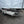 Load image into Gallery viewer, PRE OWNED 2018 ALUMA 82&quot;X14&#39; UTILITY TRAILER W/ SIDE RAMPS
